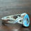 Thumbnail: Sterling Silver Blue Topaz Ring Braided Band December Birthstone