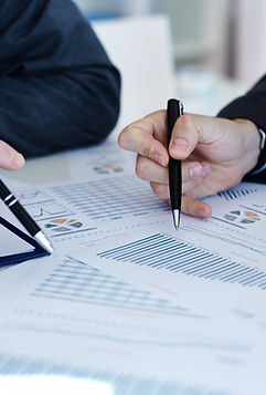 Two team members analyzing financial data