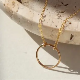 Solid gold necklace and charms