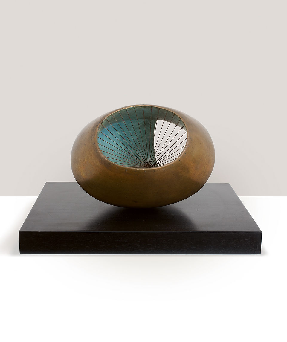  Bronze oval sculpture with teal interior and radial spokes, displayed on a black pedestal against a white background. Barbara Hepworth, Sculpture with colour and strings, 1939 (cast 1961). Courtesy of Piano Nobile. Private Collection copy