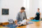 A calm person sitting cross-legged in a quiet space, symbolizing the idea of finding time to meditate even in a busy schedule.