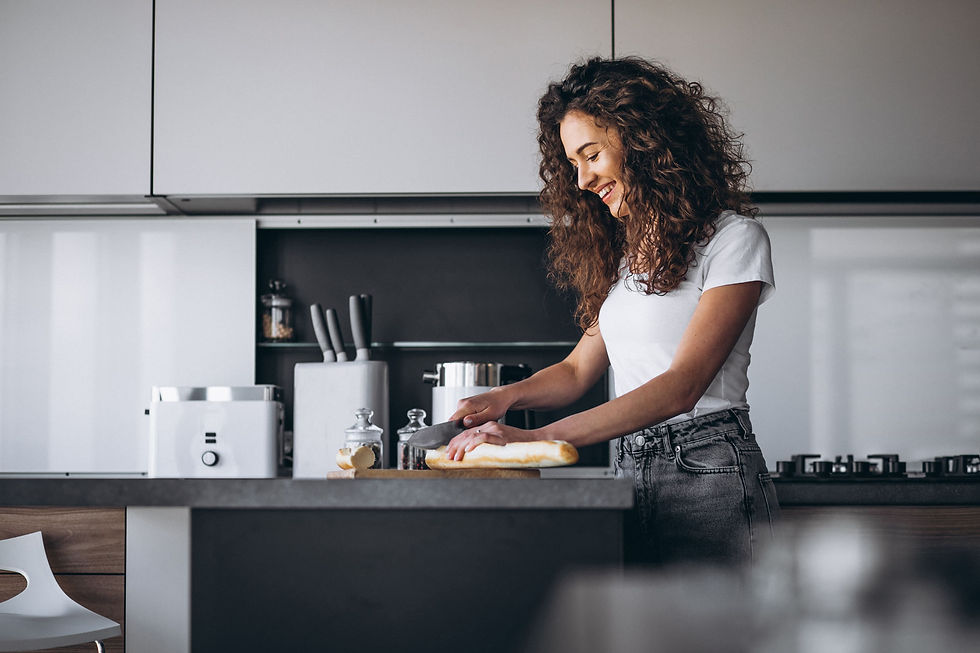 Female guest enjoying a fully equipped kitchen in a vacation rental on the French Riviera