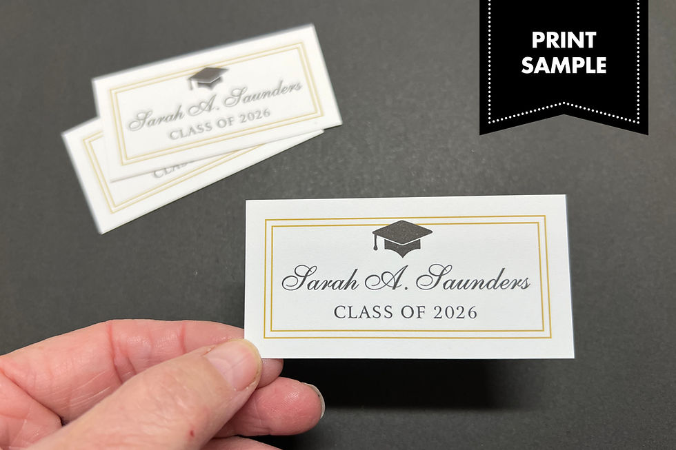 Thumbnail: Printed sample of graduation name card, held up for size reference