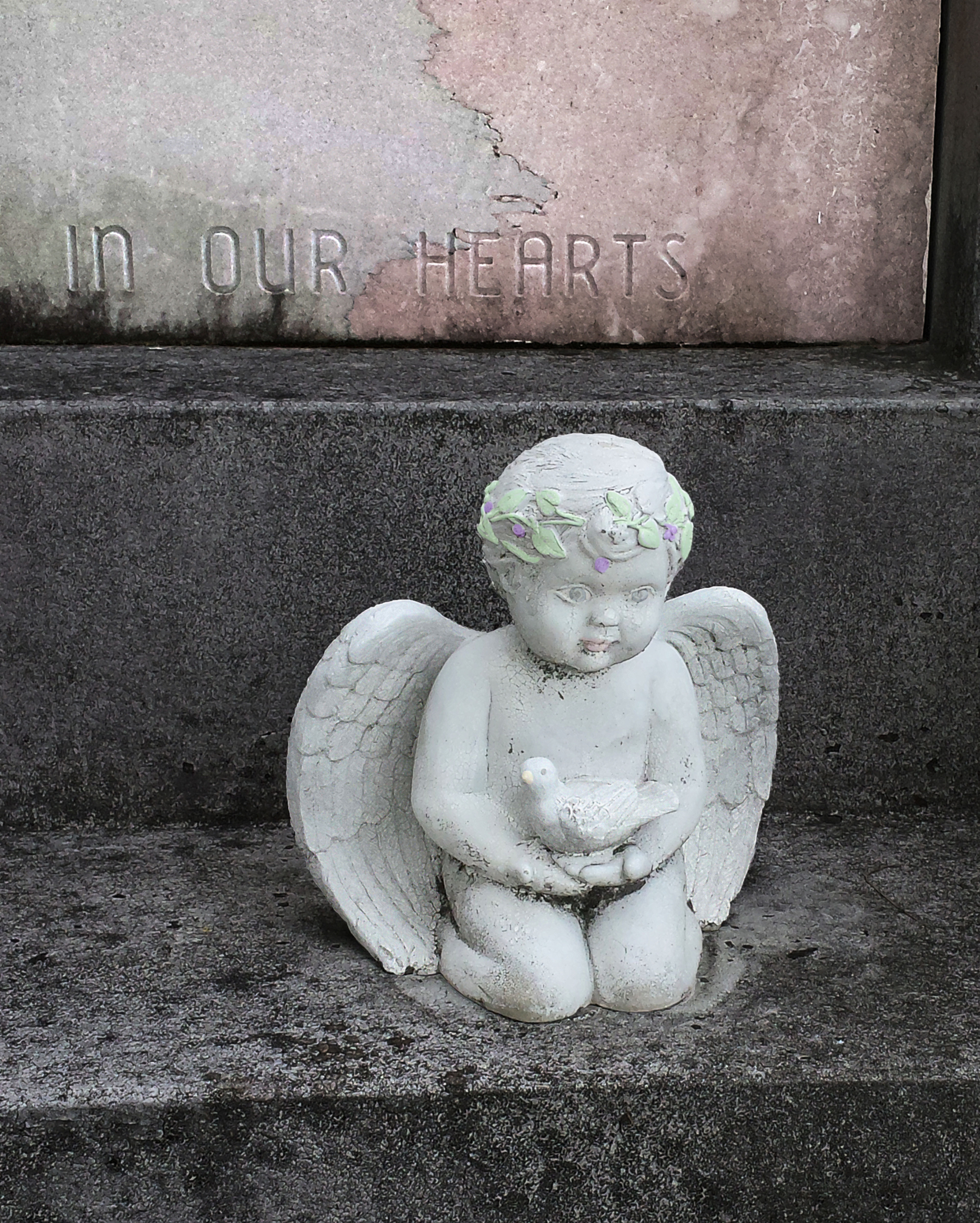 In Our Hearts Angel Cherub in Lafayette Cemetery New Orleans