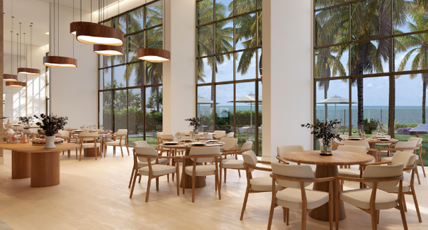Salão de festas luxuoso e climatizado, mobiliado com mesas redondas, cadeiras de design moderno, balcão de apoio e iluminação sofisticada para eventos.