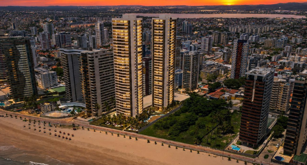 Perspectiva artística da imponente fachada do Beiramar Piedade Prince, uma torre residencial de alto padrão com varandas de vidro e vista definitiva para o mar.