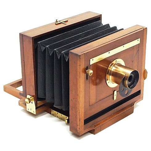 5 x 8" Scovill Waterbury with mahagony body.