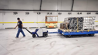Zallys M20 electric industrial tugger for towing airport trolleys carrying secure cargo