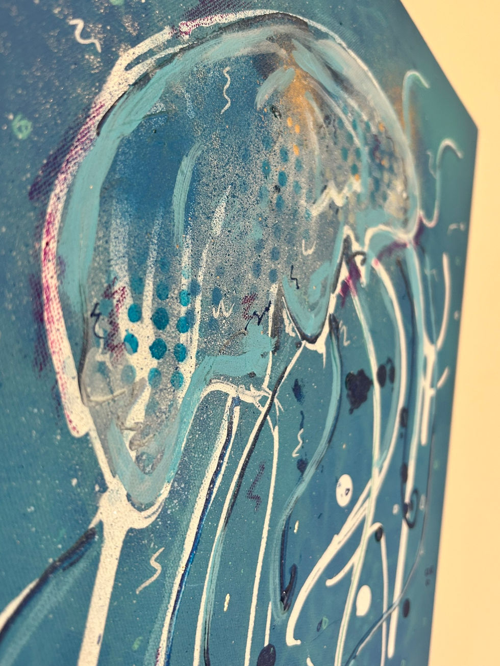 a close up of a blue painting with white lines and dots