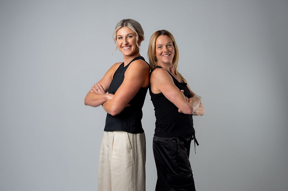 Loretta Hogg and Dr. Stacy Sims in a studio setting, representing their shared focus on strength training and women’s health.