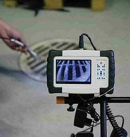 Camera in the drain while screen is showing what is inside