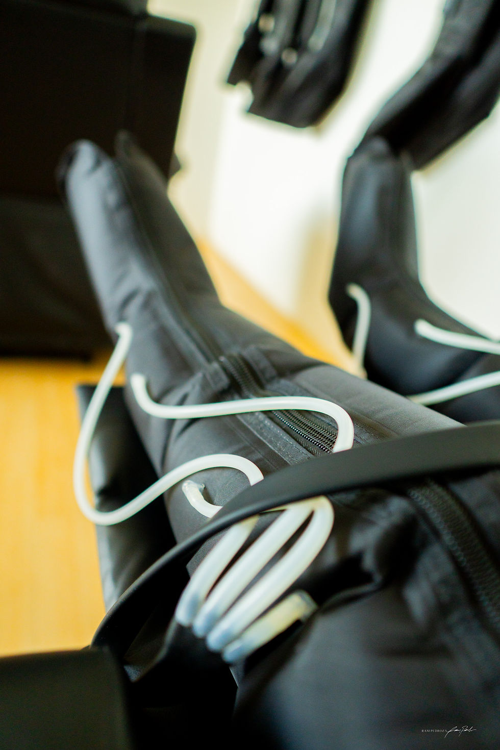 Close-up view of compression boots in use on legs