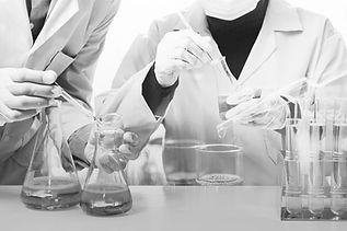 researcher-with-glass-laboratory-chemical-test-tubes-with-liquid-analytical2.jpg