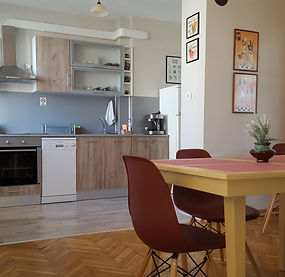Bright and welcoming apartment interior featuring a fully equipped kitchen, dining area, and modern finishes, designed for a comfortable and relaxing stay in Varna.