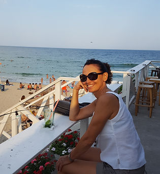 Warm and authentic photo of the host by the sea in Varna, overlooking the Black Sea from a sunny terrace and creating a friendly, personal, and welcoming atmosphere for future guests.