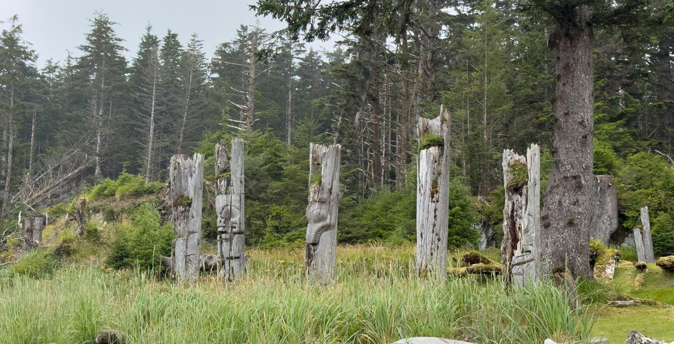 Poles at SG̱ang Gwaay Llnagaay