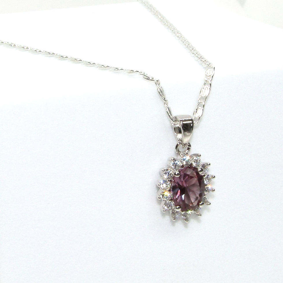 Thumbnail: The pendant, measuring 9mm in length, includes a sterling silver chain for a complete look