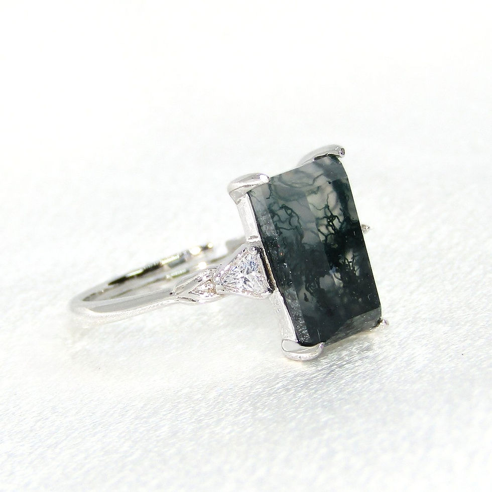 Thumbnail: Majestic Moss Agate Ring with a large central stone and prong setting, enhancing the gemstone’s beauty.