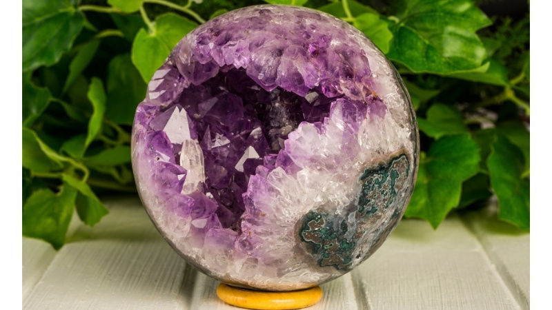 High angle view of a crystal sphere resting on a wooden surface