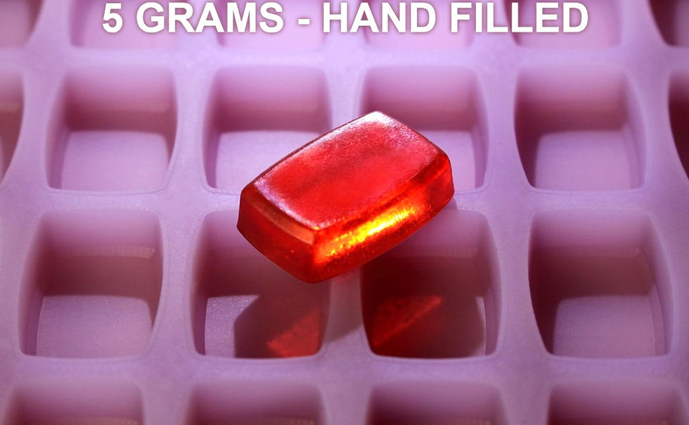 Red soap in mold, "GRAMS - HAND FILLE".