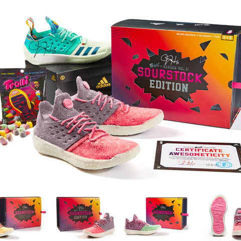 Adidas basketball shoes in pink and purple with a 'Sourstock Edition' box and candy