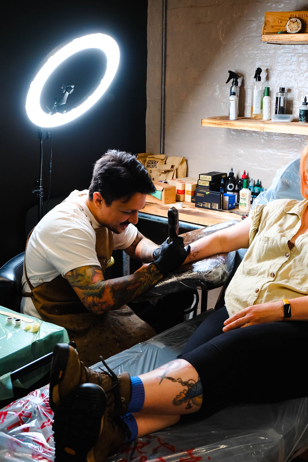 Tattoo artist at work.