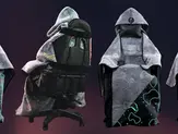 Level Up Wrap glow-in-the-dark gaming blanket with Neon Nexus pattern on a gaming chair