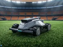 TerraMow X AWD on Kickstarter all-wheel drive robot mower on a stadium pitch showing low-profile chassis and wide cutting deck
