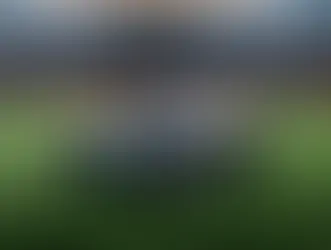 TerraMow X AWD on Kickstarter all-wheel drive robot mower on a stadium pitch showing low-profile chassis and wide cutting deck