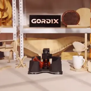 Gordix portable CNC on Kickstarter displayed with completed woodworking projects and prototypes