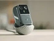 BirdieSense Golf AI Companion on Kickstarter, shown close up on its golf-ball charging stand.