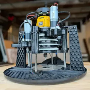  Maslow 4.1 CNC kit sled close-up showing DeWalt router mount, belt drive motors, and injection-molded frame