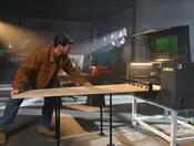 Gweike MCore laser cutter on Kickstarter using the intelligent conveyor for oversized material feeding
