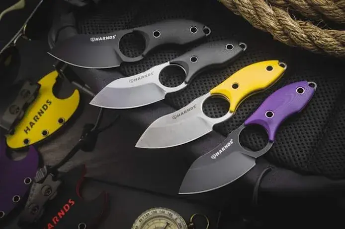 Eggplant Knife by HARNDS with sleek curved blade design.