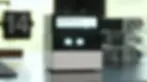 Cubie AI desktop robot on desk showing dual screen expression system with text and eye display, offline AI companion from EgoScience on Kickstarter