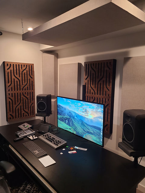 Studio with acoustic treatment including acoustic ceiling and wall panels