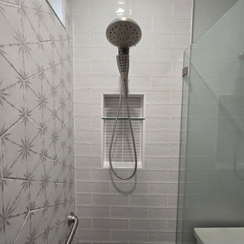 Charlotte guest bathroom remodel with custom tiled stand-up shower and frameless glass panel door