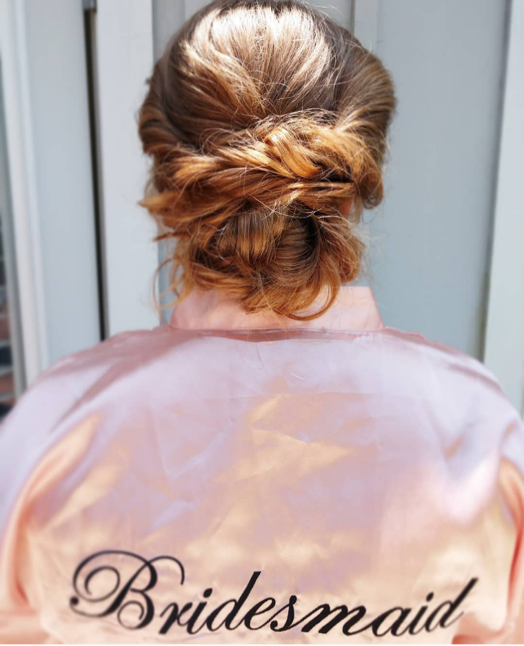 soft romantic touseled updo hairstyle for a wedding