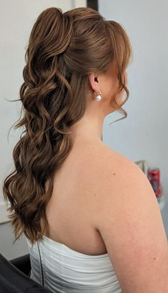 bride with half up half down party pony hairstyle by st augustine hairstylist