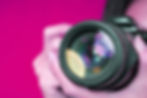 A person using a professional camera to record a marketing video