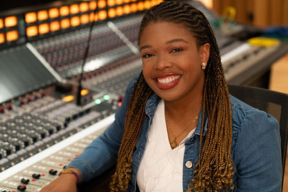 Headshot of Autumn Mallard next to the console