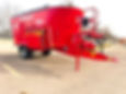 Red Trioliet 2000L ZK vertical mixer on a farm