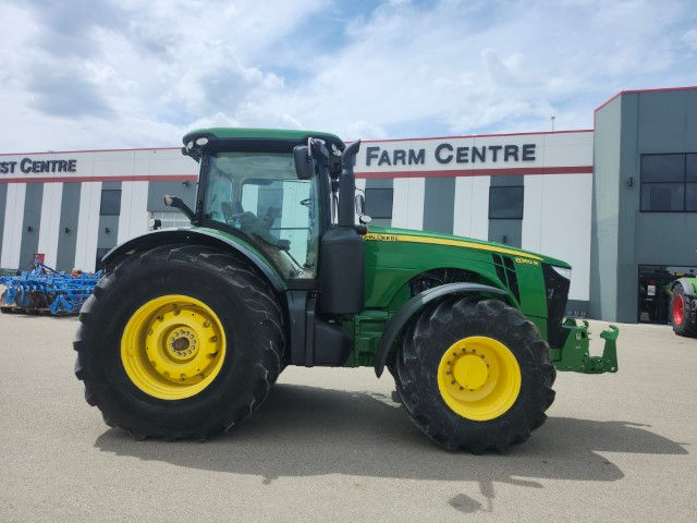 Side view of a 2012 John Deere 8360R tractor at a farm centre.