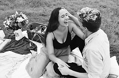 couple laughing at picnic