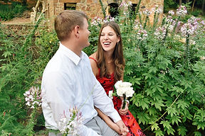 couples photos session with flowers at the park, laughing woman