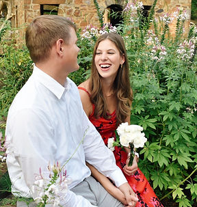 couples photos session with flowers at the park, laughing woman