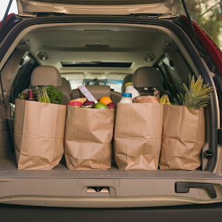 Bags of groceries in the back of a car