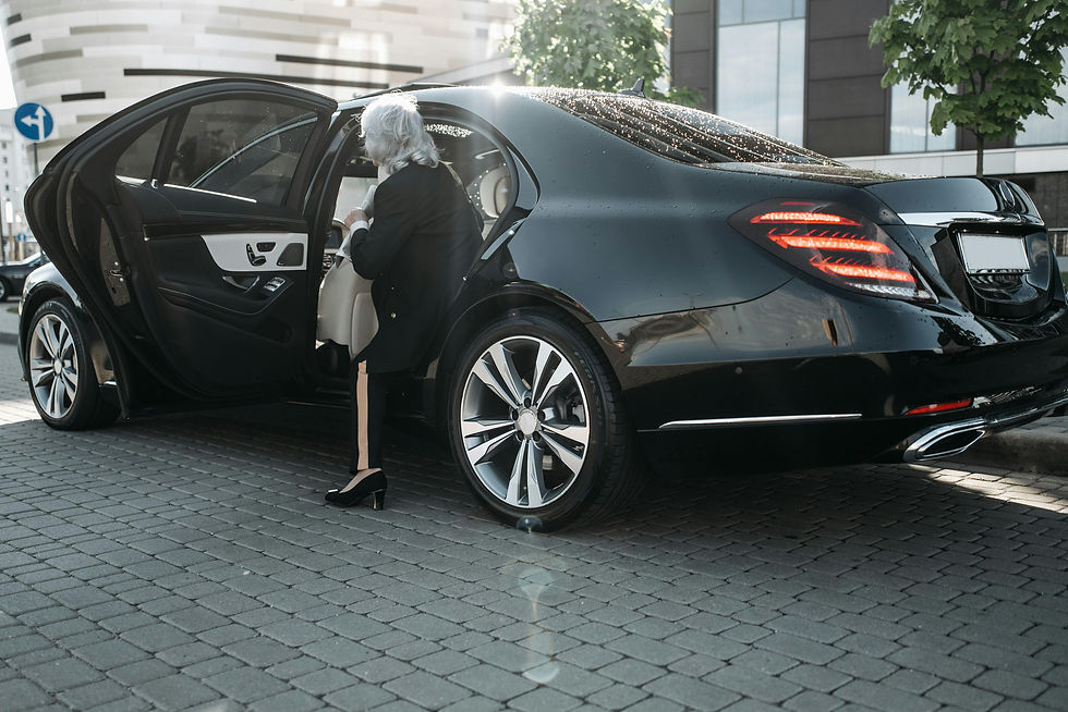 Corporate executive entering luxury vehicle for business travel with PCD Chauffeurs NZ