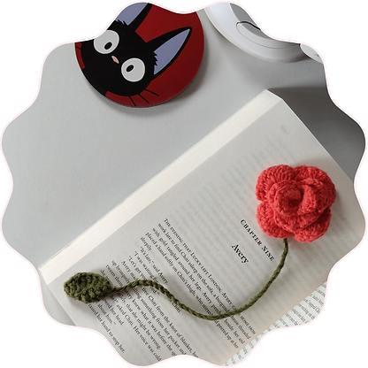 a image of crochet bookmark with a coaster of kiki in it
