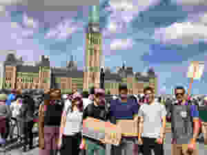 Students supporting the global climate strike at parliament hill in step3project clothing